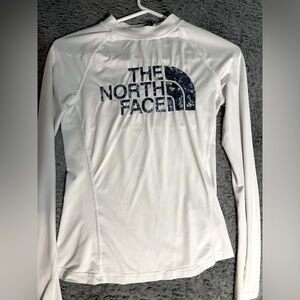 xs north face long sleeve , barley used no wear and tear , with thumb holes .